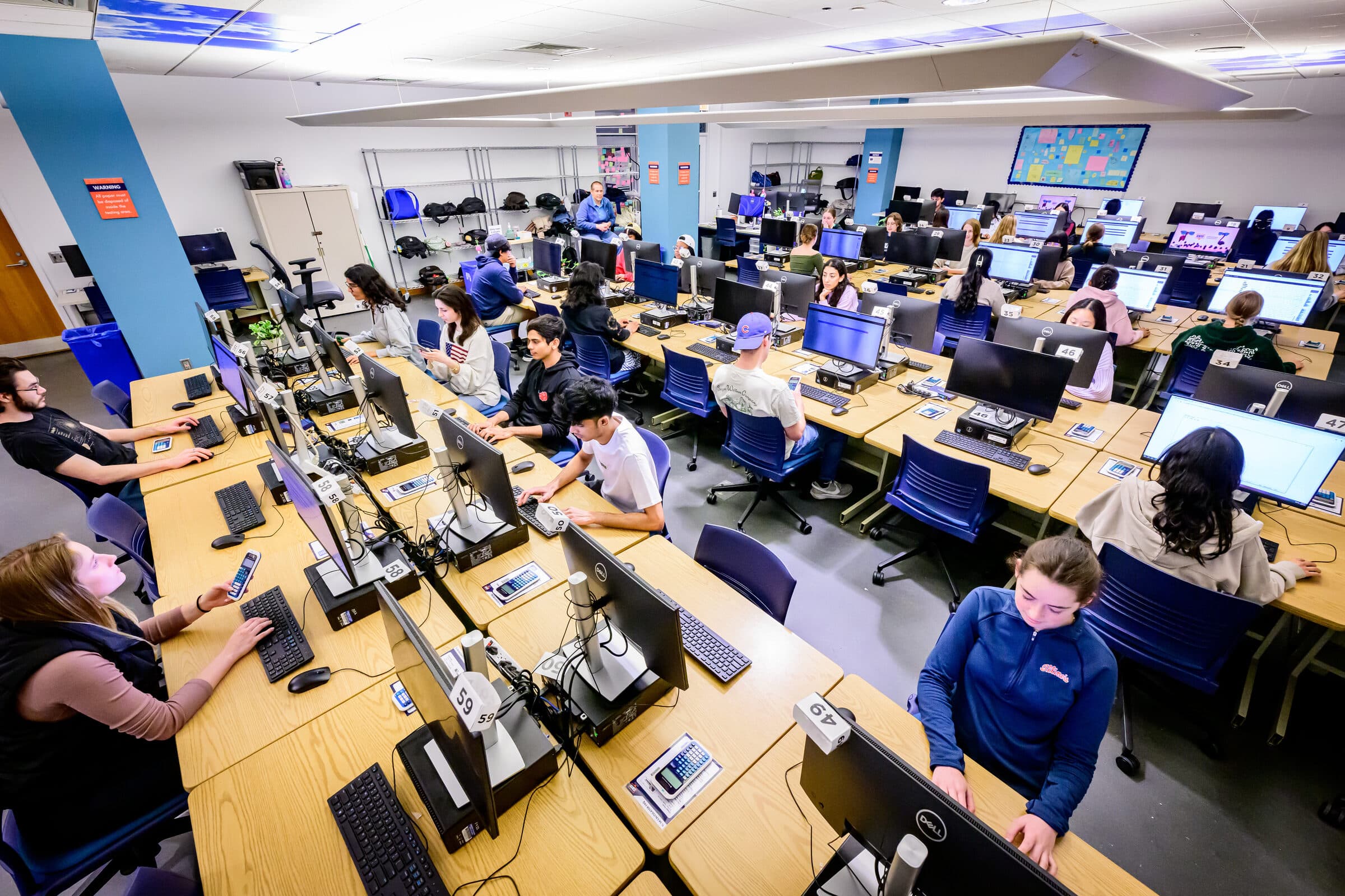 Students taking exams in a computer-based testing facility
